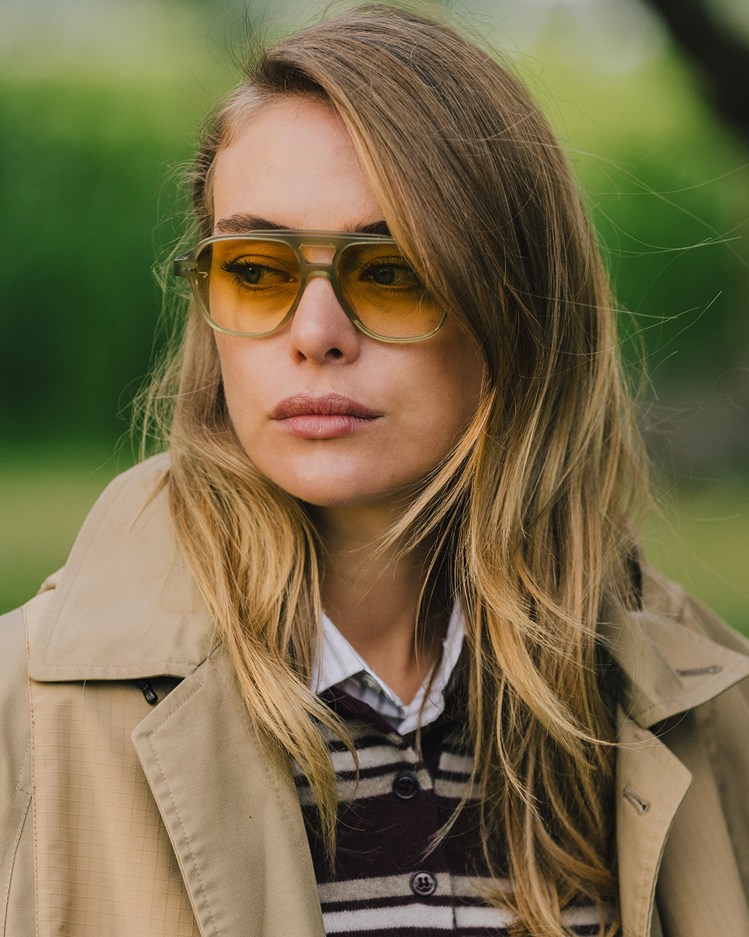 The ACE Hub Johnny Loco sunglasses with yellow lenses, worn outdoors in a natural setting.