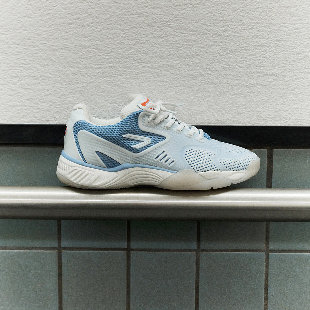 The ACE Hub OC sneaker in sea ice and white, photographed indoors against a tiled wall.