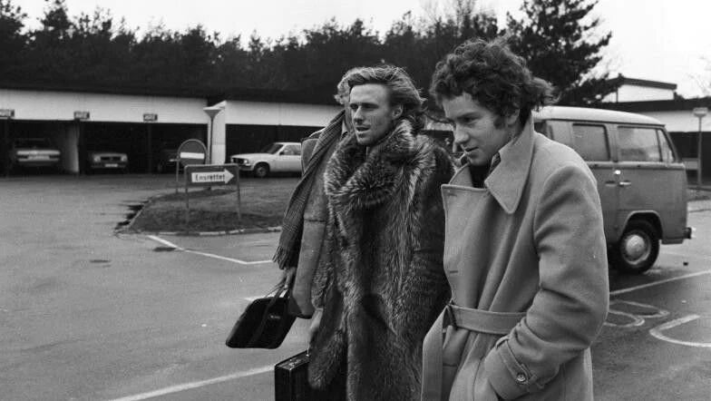 Borg in his fur coat alongside rival John McEnroe in a camel hair trench coat.